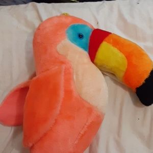 A stuff bird and stuff teddy bear